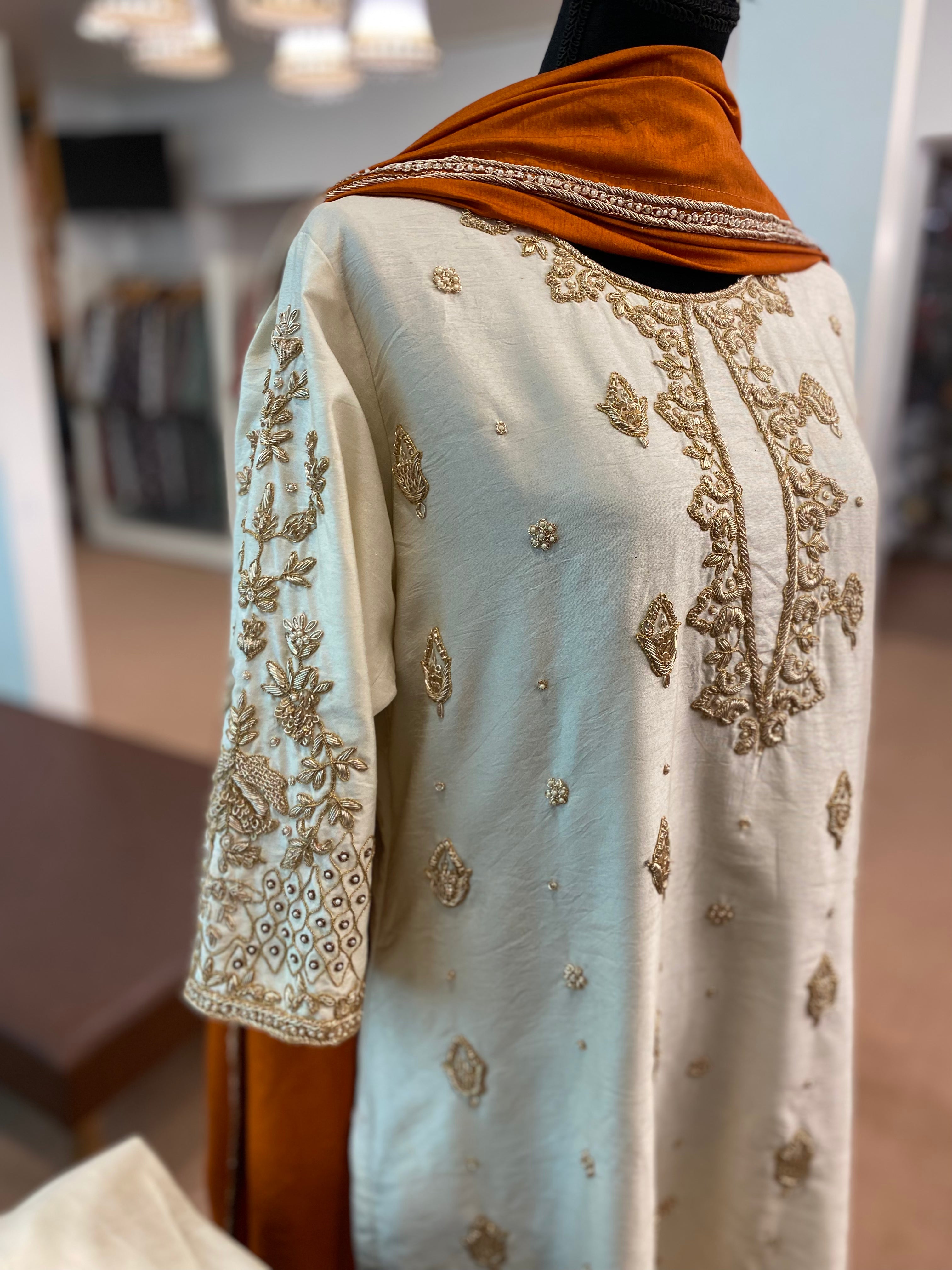 Hand embroidered Off white suit with rust duppata